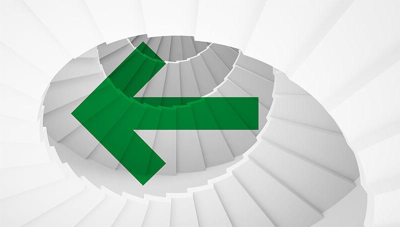Green arrow pointing right, overlaid a spiral of white stairs